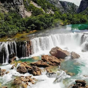 Drone shot of a tall waterfall on Zrmanja river