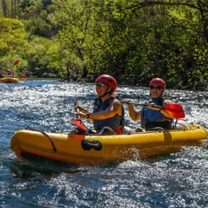 Two people smiling and kayaking on Zrmanja rive