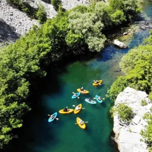 Birds eye view of a group of people in packraft boats paddling down Zrmanja river