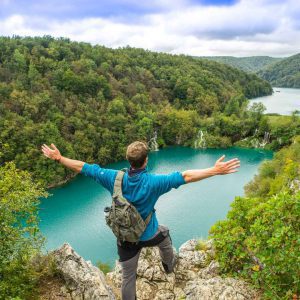 A person enjoying freedom at Plitvice lakes in Croatia